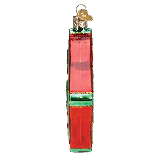 Old World Christmas Christmas quilt ornament featuring festive patchwork design with colorful holiday patterns.