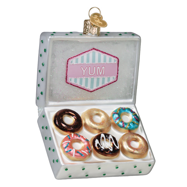 Old World Christmas box of donuts ornament featuring colorful donut shapes and festive packaging, ideal for holiday decor.