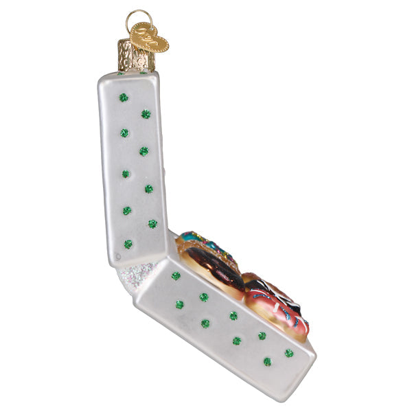 Colorful box of donuts ornament by Old World Christmas with detailed donut shapes and vibrant icing decorations.
