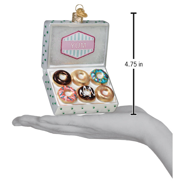 Colorful box of donuts ornament by Old World Christmas, detailed festive holiday decoration with donut shapes and vibrant colors.