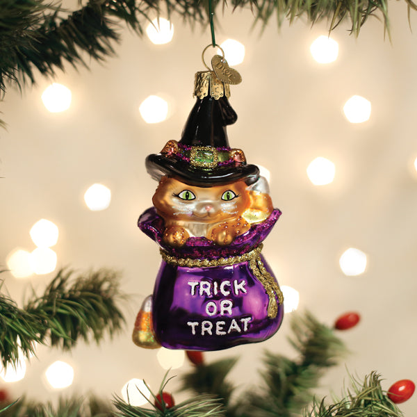 Old World Christmas Trick-or-Treat Kitty ornament featuring a festive black cat with a pumpkin hat and Halloween decorations.