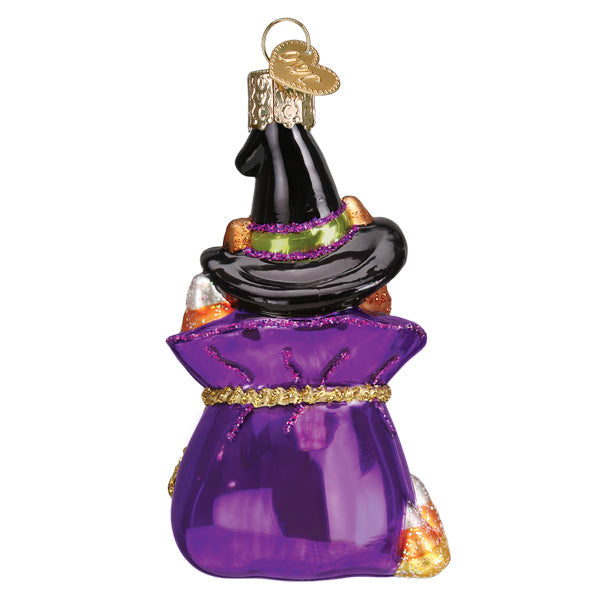 Old World Christmas Trick-or-treat kitty ornament featuring a cute black cat wearing a Halloween costume, detailed and festive.