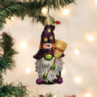 Old World Christmas Witch Gnome Ornament with pointed hat and broom, detailed Halloween-themed gnome decoration.