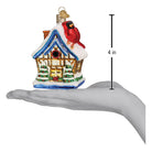 Old World Christmas Cardinal Birdhouse Ornament featuring a colorful red cardinal perched on a miniature birdhouse.