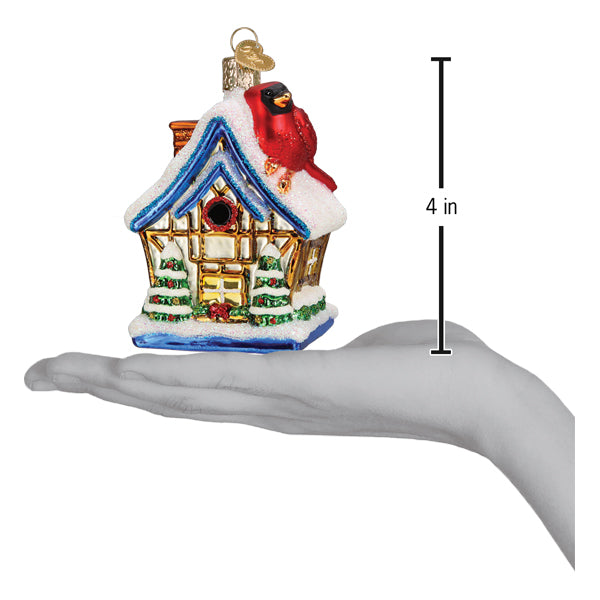 Old World Christmas Cardinal Birdhouse Ornament featuring a colorful red cardinal perched on a miniature birdhouse.