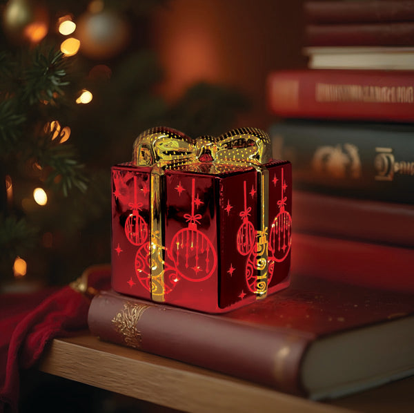 Glass gift box with lit ornamental design by Old World Christmas, featuring intricate glass craftsmanship and festive decorative details.