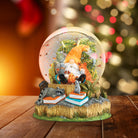 Old World Christmas Autumn Forest Gnome snow globe featuring a gnome figure amid autumn forest scenery inside a glass globe.