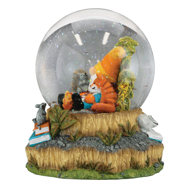 Old World Christmas Autumn Forest Gnome Snow Globe featuring a gnome figure amid autumn leaves inside a glass globe.