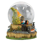 Old World Christmas Autumn Forest Gnome Snow Globe featuring a gnome figure amidst autumn forest scenery inside a glass globe.