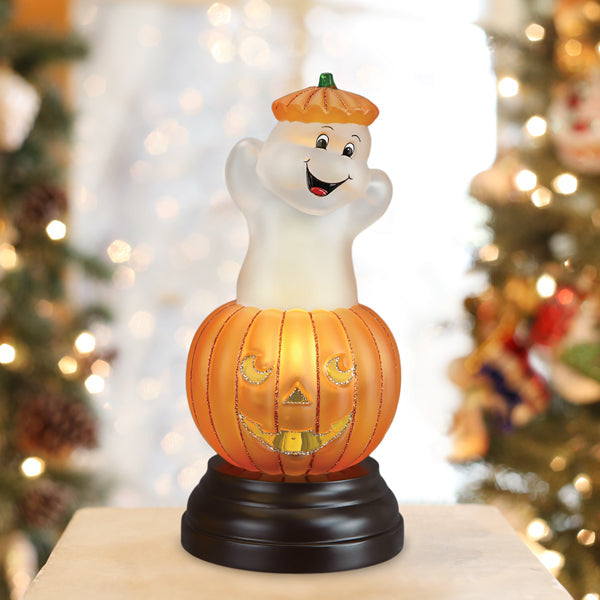 Old World Christmas Ghost Pumpkin Light ornament featuring a spooky pumpkin design with ghost accents on a festive background.
