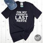 Unisex black graphic T-shirt featuring humorous "On My Parent's Last Nerve" design by The Graphic Tee.