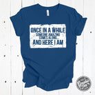 Black short sleeve graphic tee from The Graphic Tee with the phrase "Once in a while someone amazing comes along" in stylish font.