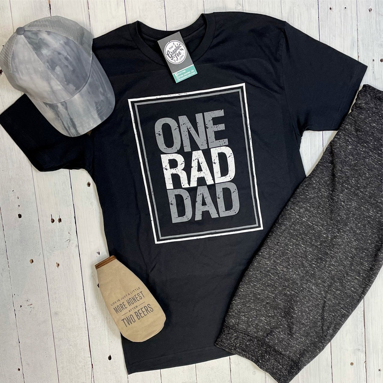 Adult SS graphic tee from The Graphic Tee featuring a "One Rad Dad" design, perfect for casual wear.