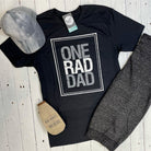 Adult SS graphic tee from The Graphic Tee featuring a "One Rad Dad" design, perfect for casual wear.