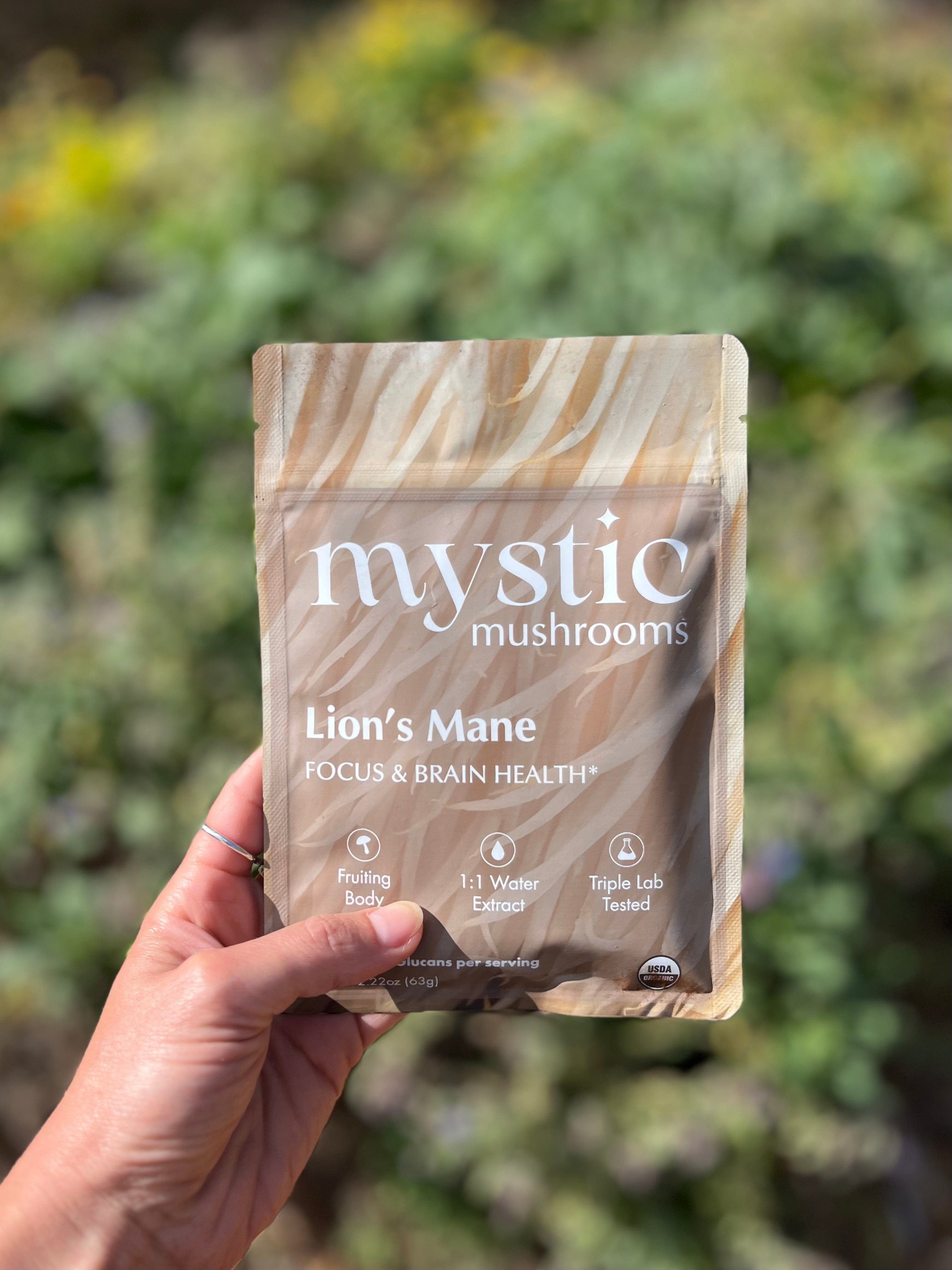 Pack of Ora Cacao Lion's Mane mushroom supplement capsules in a clear plastic container showing the product label.
