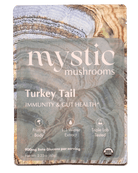 Ora Cacao Turkey Tail mushroom supplement in a clear bottle with a label, showing dried Turkey Tail fungi inside.