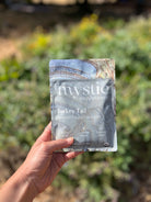 Fresh Turkey Tail mushroom supplement from Ora Cacao, showing dried, sliced mushroom pieces in a clear container.
