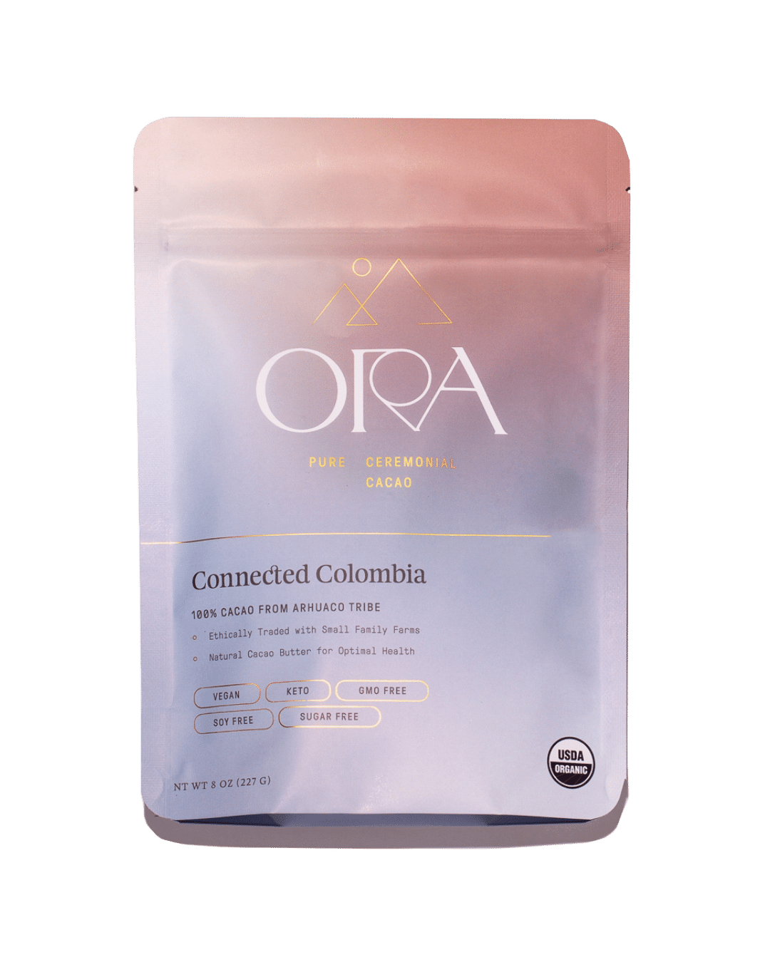 Pure 100% ceremonial cacao from Ora Cacao, connected Colombia, shown in a 1 lb package with rich cacao beans and natural setting.