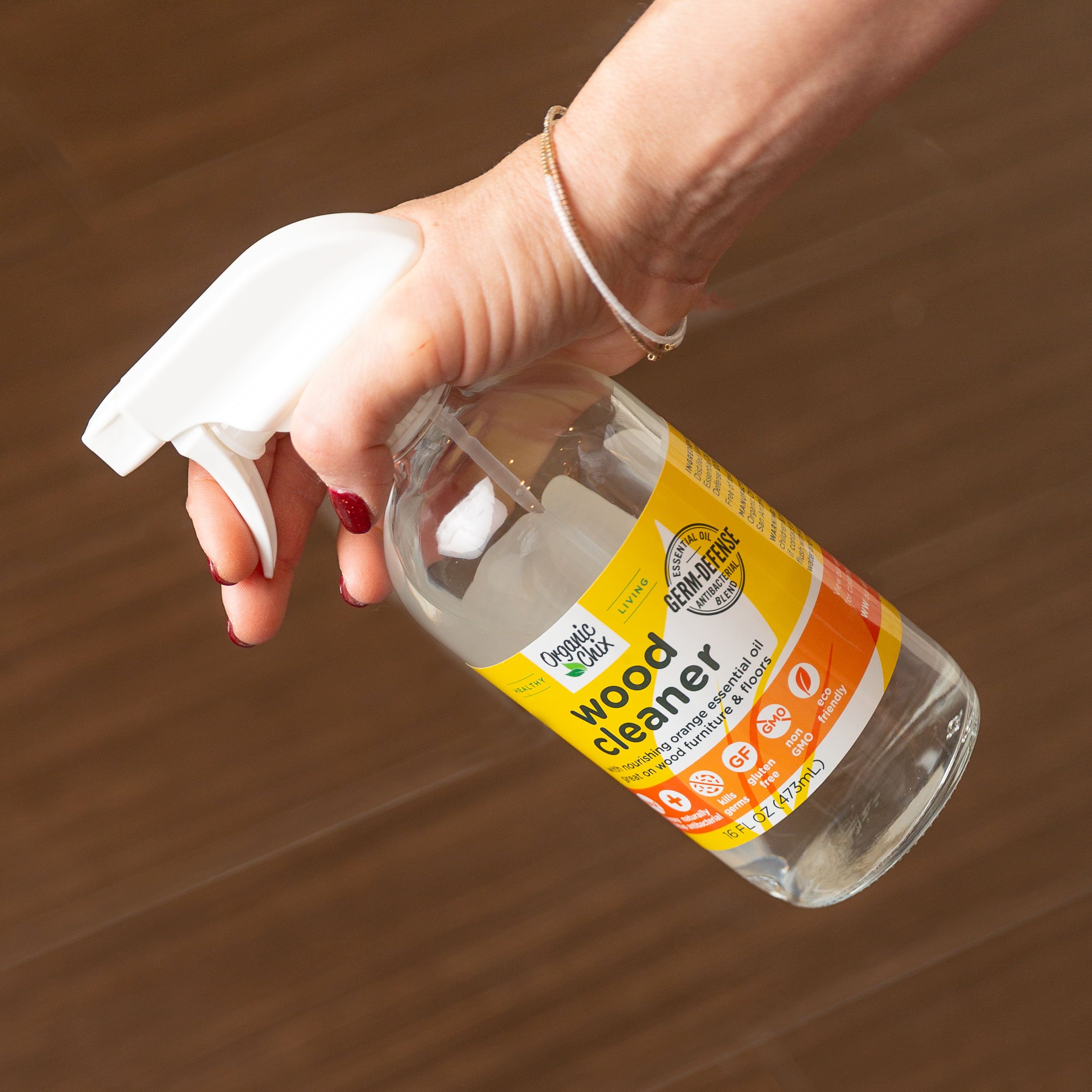 Organic Chix natural non-toxic wood cleaner in a spray bottle, suitable for healthy, eco-friendly wood surface cleaning.