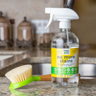 Organic Chix Natural Non-Toxic Stain Remover for healthy laundry, showing a spray bottle and stain removal process.