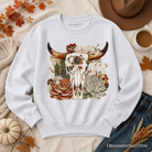 Boho floral cow skull sweatshirt from OrnamentallyYou featuring western autumn cowgirl design, cozy and stylish sweatshirt for fall.