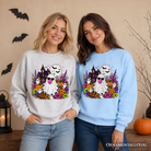 Colorful floral Halloween pumpkin sweatshirt featuring a bubblegum ghost haunted house design by OrnamentallyYou.