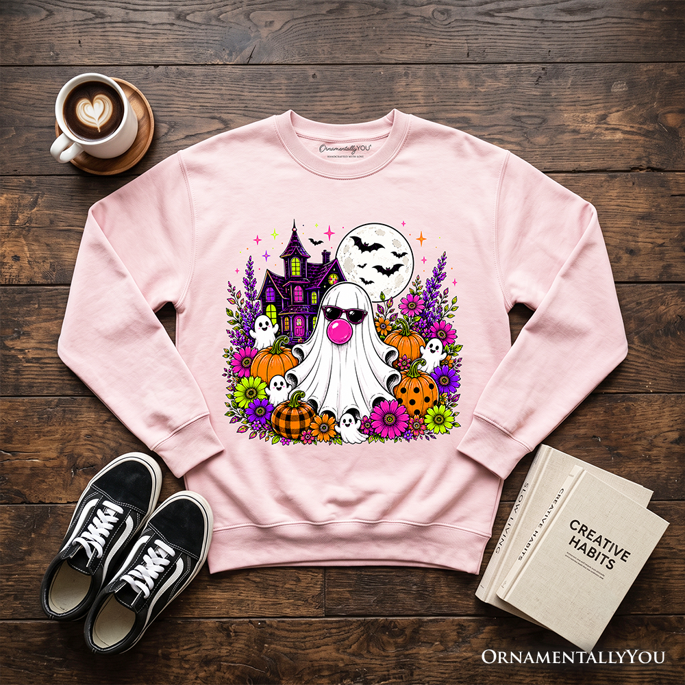 Colorful floral Halloween pumpkin sweatshirt featuring a bubblegum ghost haunted house design on a cozy OrnamentallyYou sweatshirt.