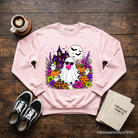 Colorful floral Halloween pumpkin sweatshirt featuring a bubblegum ghost haunted house design on a cozy OrnamentallyYou sweatshirt.