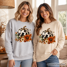 Cow Pumpkin Floral Sweatshirt by OrnamentallyYou featuring autumn harvest design, western style, with cow and pumpkin floral pattern.