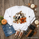 Cow pumpkin floral sweatshirt by OrnamentallyYou featuring autumn harvest design, cozy western-style sweatshirt in ash color.