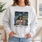 Funny doll face baseball sweatshirt for sports fan moms by OrnamentallyYou, featuring a playful doll graphic on ash-colored fabric.