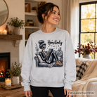 Ash gray Homebody Reading Skeleton sweatshirt by OrnamentallyYou, a funny lazy self-care sweater for introvert women.