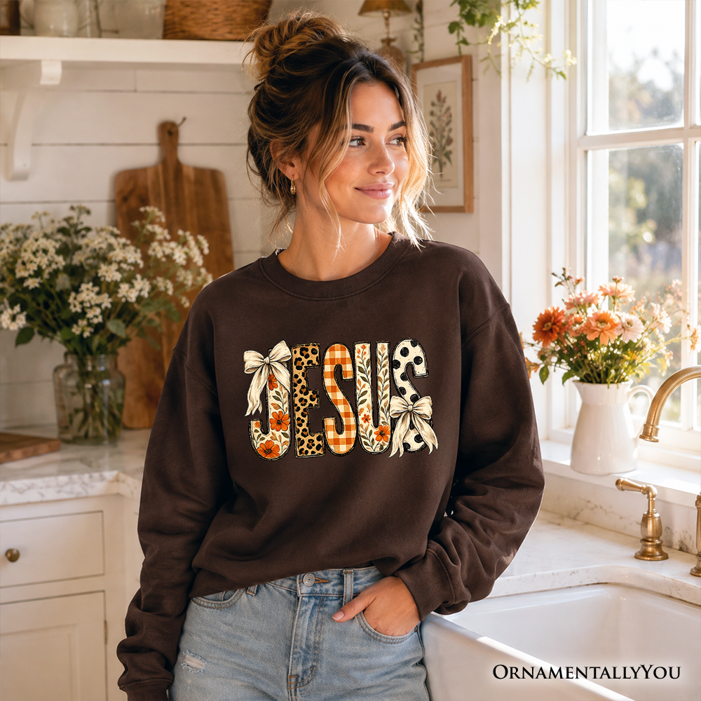 Jesus Coquette Fall sweatshirt by OrnamentallyYou featuring leopard plaid floral design and Christian faith-inspired graphics.
