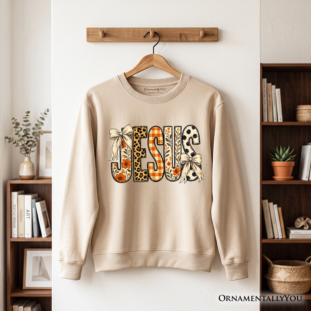 Jesus Coquette Fall Sweatshirt by OrnamentallyYou featuring leopard plaid and floral Christian faith design on a cozy sweatshirt.