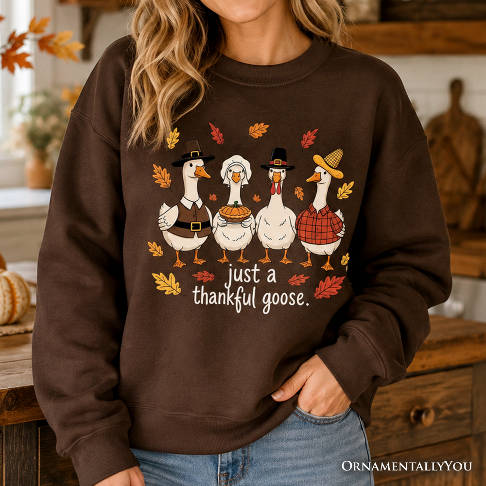 Ash-colored Just a Thankful Goose sweatshirt by OrnamentallyYou, featuring a humorous Thanksgiving-themed design for family gatherings.