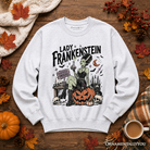 Ash gray Lady Frankenstein sweatshirt by OrnamentallyYou featuring vintage gothic design and undead Halloween-inspired artwork.