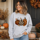 Leopard checkered pumpkin print autumn fall sweatshirt from OrnamentallyYou, cozy casual sweater for cooler weather.