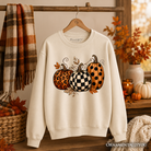Leopard checkered pumpkin sweatshirt by OrnamentallyYou, cozy autumn fall sweater in ash gray with fall-themed print.