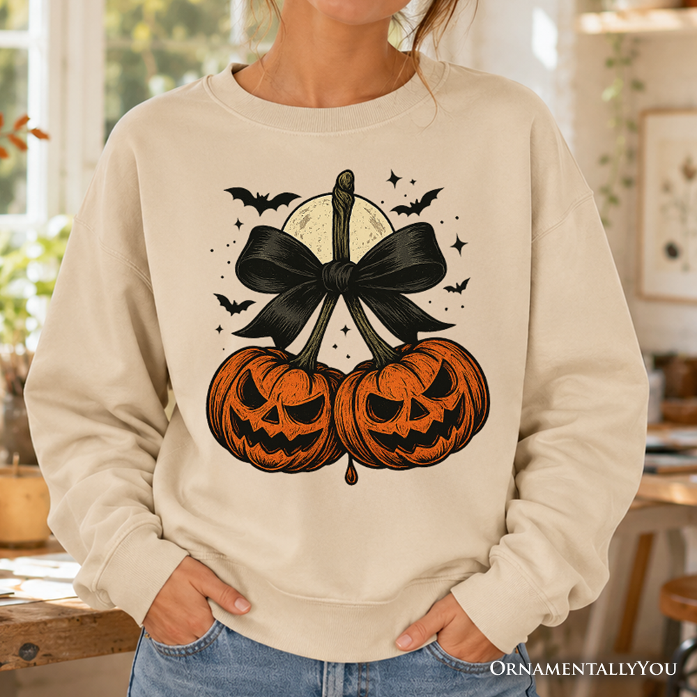 Orange Pumpkin and cherry print Coquette Bow Sweatshirt by OrnamentallyYou, featuring a retro Halloween fall design for girls.