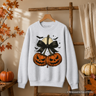 Orange and black Pumpkin Cherries Coquette Bow sweatshirt by OrnamentallyYou featuring a retro Halloween fall design for girls.