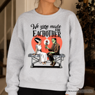 Romantic Frankenstein and Bride sweatshirt by OrnamentallyYou, featuring spooky couple design on cozy ash-colored sweatshirt.