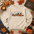 Black Halloween sweatshirt featuring skeleton cats and pumpkins by OrnamentallyYou, perfect for spooky fall celebrations.