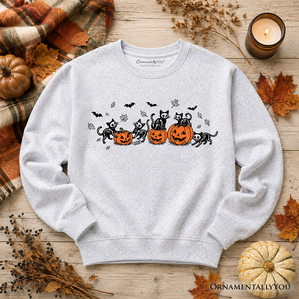 Black Halloween sweatshirt with skeleton cats and pumpkins design, featuring spooky black cat and pumpkin graphics on a cozy fabric.