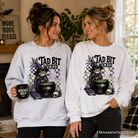 Ash gray Tad Bit Wicked Frog Witch Halloween sweatshirt with spooky cauldron design from OrnamentallyYou.