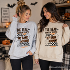 Ash gray sweatshirt by OrnamentallyYou featuring humorous "The Real Horror Story My Bank Account" design for Halloween or casual wear.