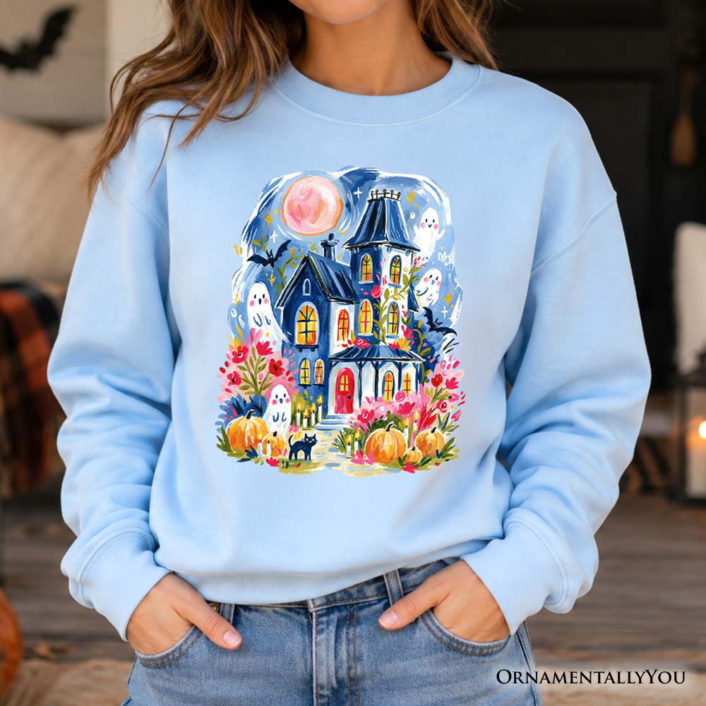 Colorful watercolor haunted house sweatshirt with ghosts and pumpkins, Halloween-themed sweater by OrnamentallyYou.