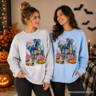 Colorful watercolor haunted house sweatshirt with ghosts and pumpkins, Halloween-themed sweatshirt by OrnamentallyYou.