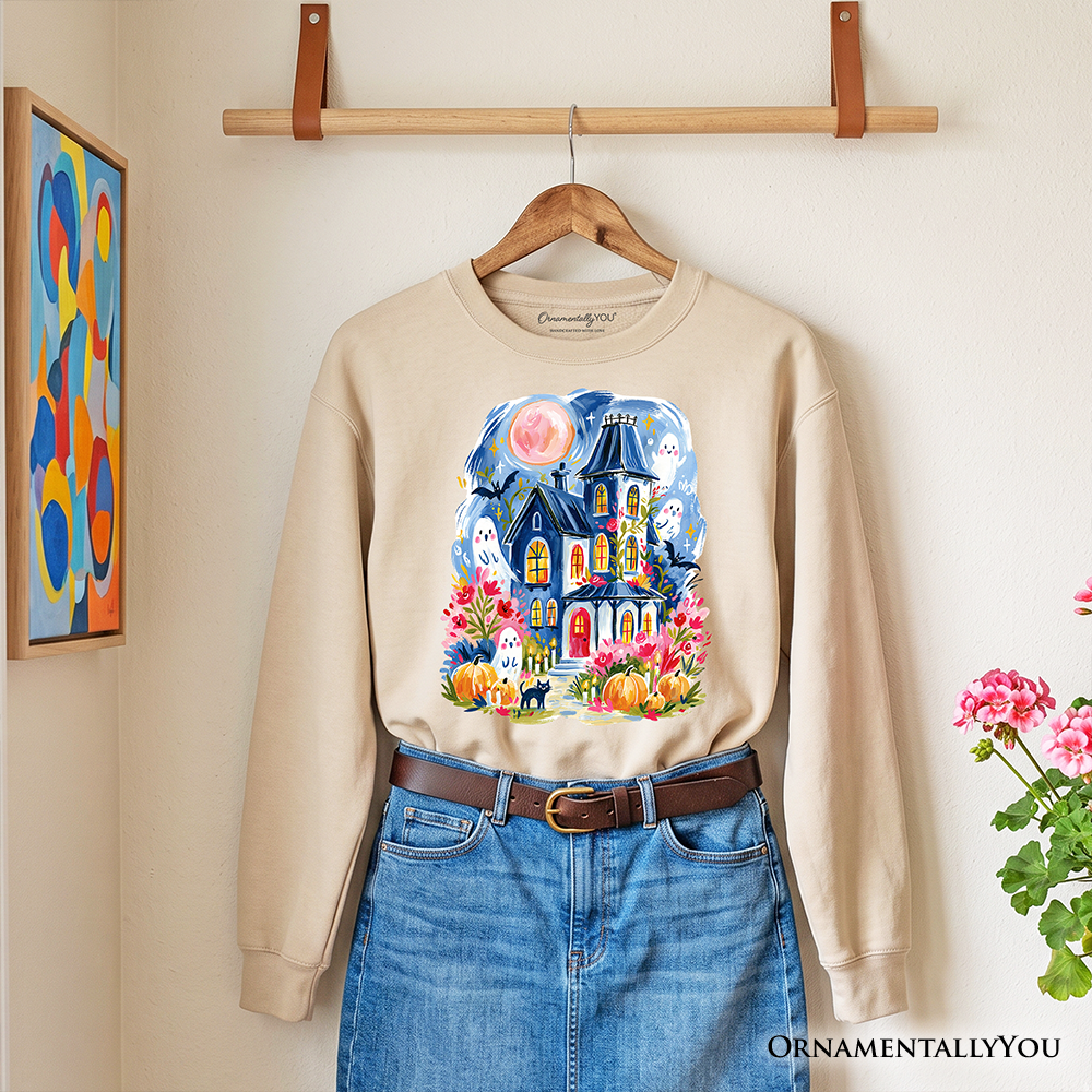 Colorful watercolor haunted house sweatshirt with ghosts and pumpkins, Halloween-themed sweatshirt from OrnamentallyYou