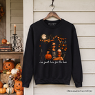 Black "I'm Just Here for the Boos" Witch Sweatshirt by OrnamentallyYou, featuring festive Halloween-themed text and cozy sweatshirt design.
