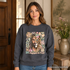 Black Lion of Judah Christian sweatshirt with floral Jesus design, featuring religious faith imagery on a cozy sweater.